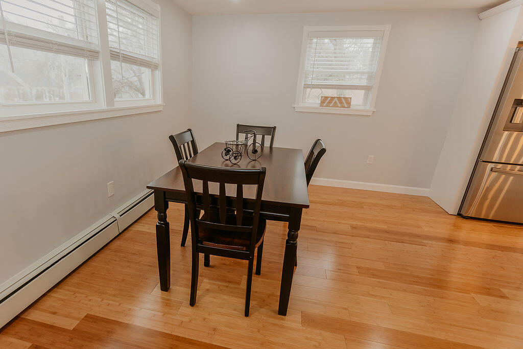 9 Rip Van Winkle Way Buzzards Bay, MA 02532 - Photo 25 of 56 a view of a dining room with furniture and wooden floor