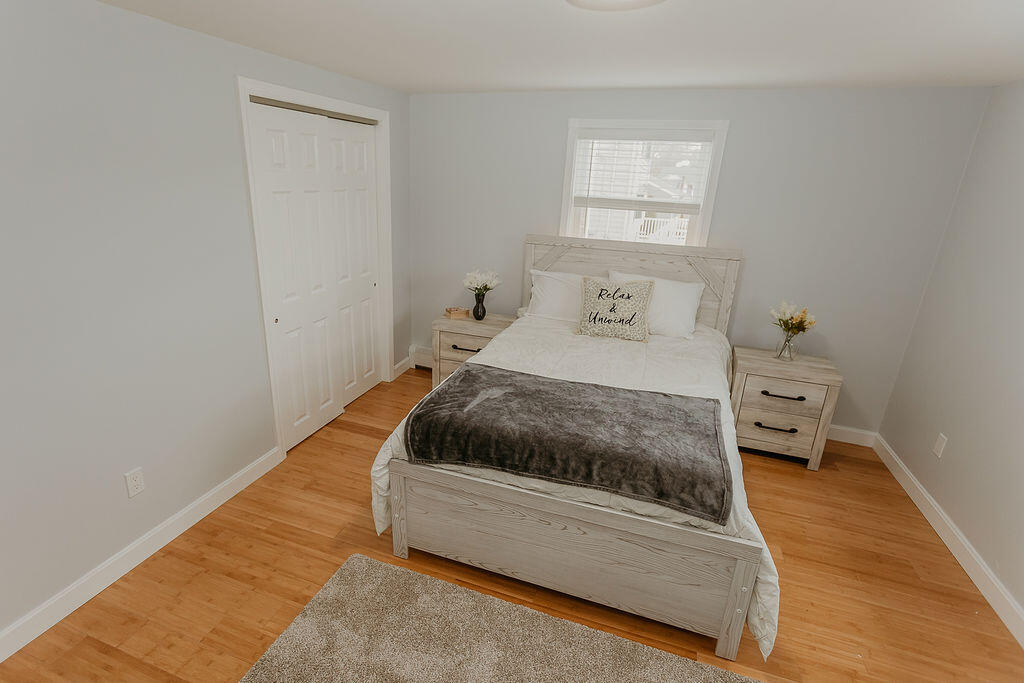 9 Rip Van Winkle Way Buzzards Bay, MA 02532 - Photo 50 of 56 a bedroom with a bed and a window