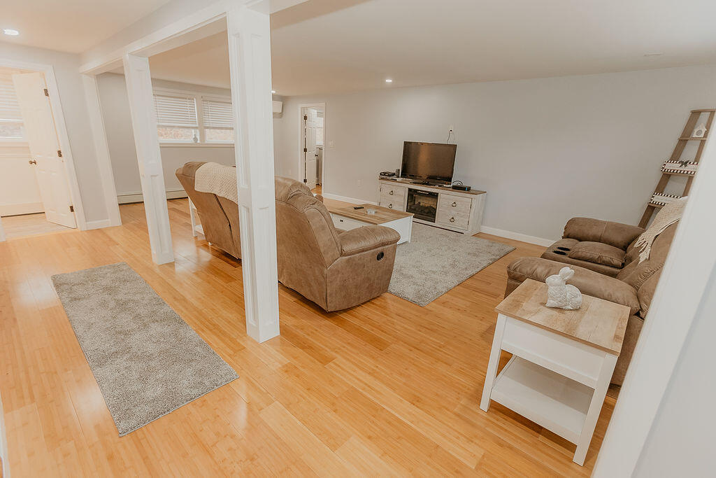 9 Rip Van Winkle Way Buzzards Bay, MA 02532 - Photo 5 of 56 a living room with furniture and a flat screen tv
