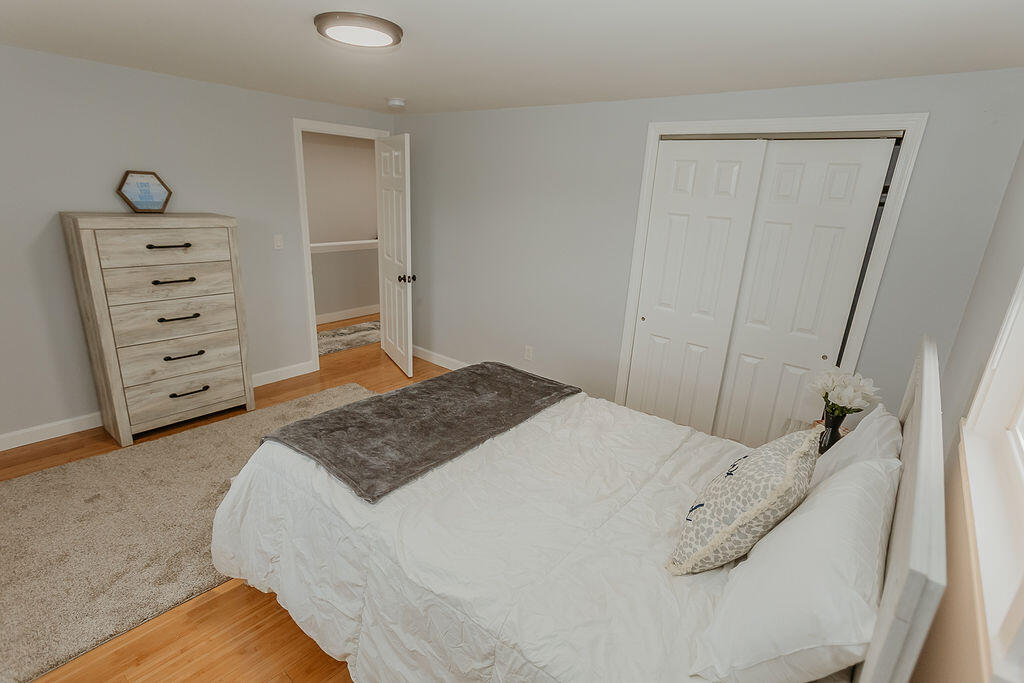 9 Rip Van Winkle Way Buzzards Bay, MA 02532 - Photo 51 of 56 a bedroom with a bed and a cabinets