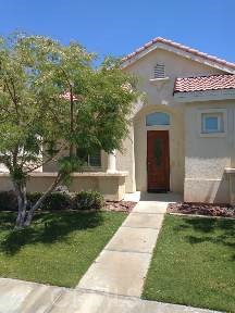 49814 Lewis Road Indio, CA 92201 - Photo 1 of 1 a front view of a house with a yard