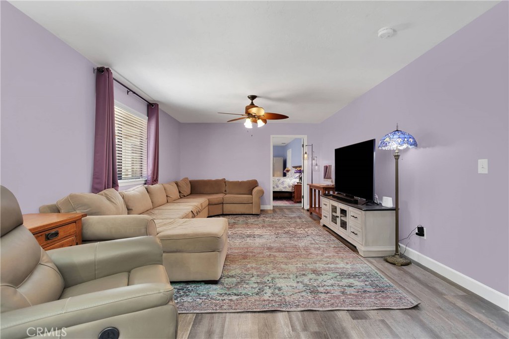 19095 Munsee Road Apple Valley, CA 92307 - Photo 13 of 58 a living room with furniture and a flat screen tv