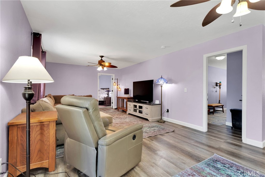 19095 Munsee Road Apple Valley, CA 92307 - Photo 14 of 58 a living room with furniture and a flat screen tv