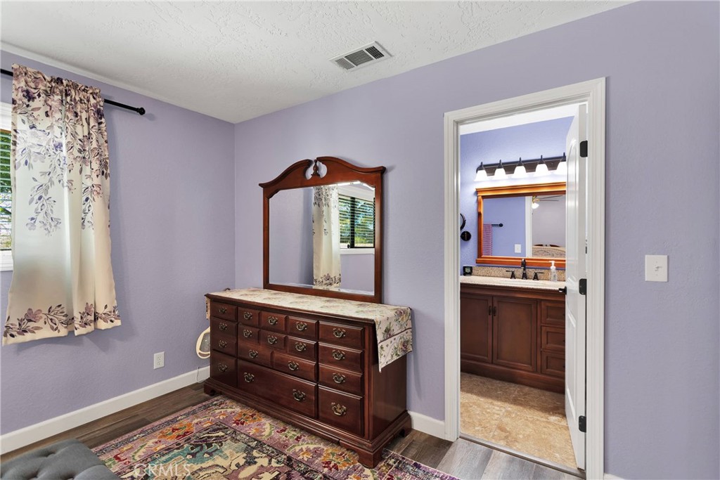 19095 Munsee Road Apple Valley, CA 92307 - Photo 25 of 58 a kitchen with stainless steel appliances granite countertop a stove a sink and a window