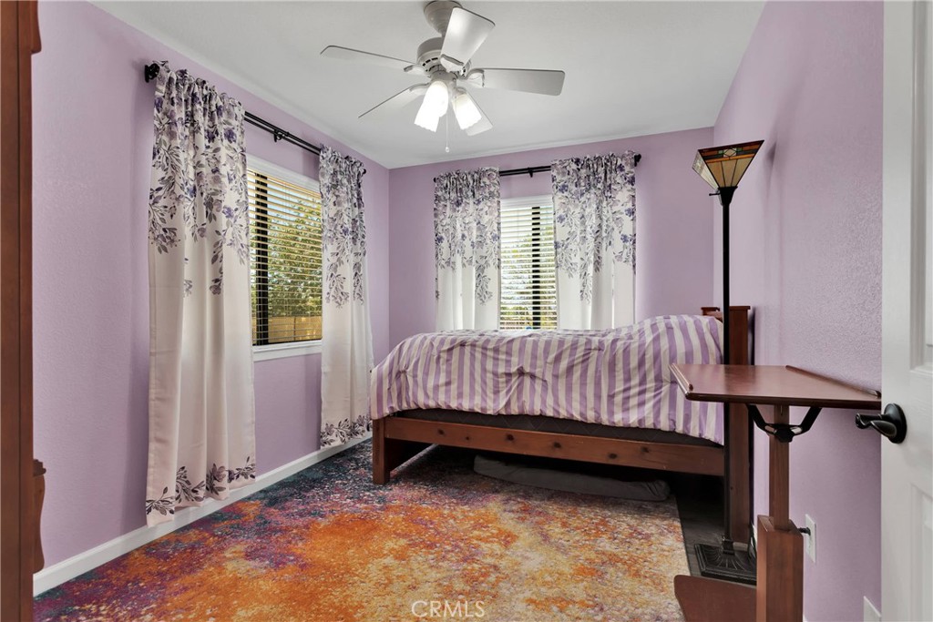 19095 Munsee Road Apple Valley, CA 92307 - Photo 31 of 58 a bed sitting in a bedroom next to a window