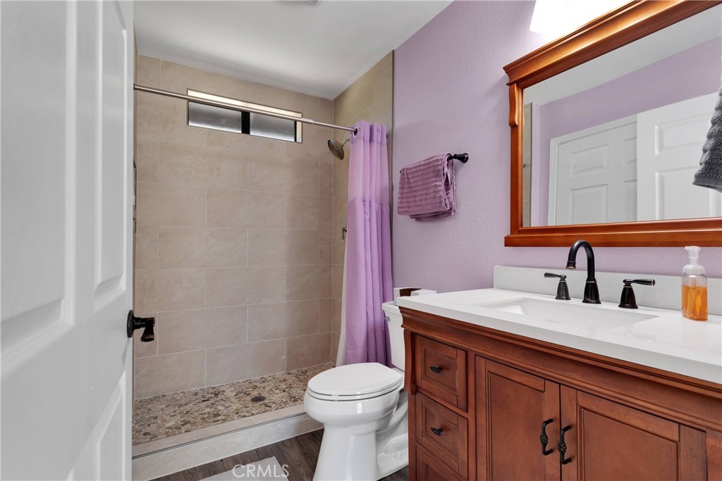 19095 Munsee Road Apple Valley, CA 92307 - Photo 32 of 58 a bathroom with a sink vanity mirror and toilet