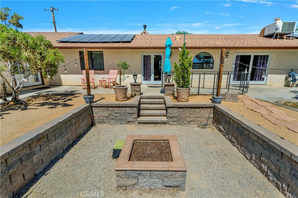 19095 Munsee Road Apple Valley, CA 92307 - Photo 38 of 58 a view of a dinning table and chair in the patio