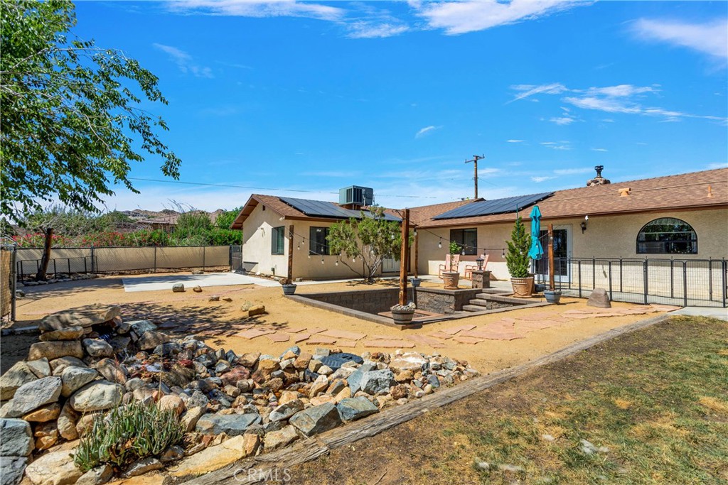19095 Munsee Road Apple Valley, CA 92307 - Photo 41 of 58 a view of a house with backyard outdoor seating area