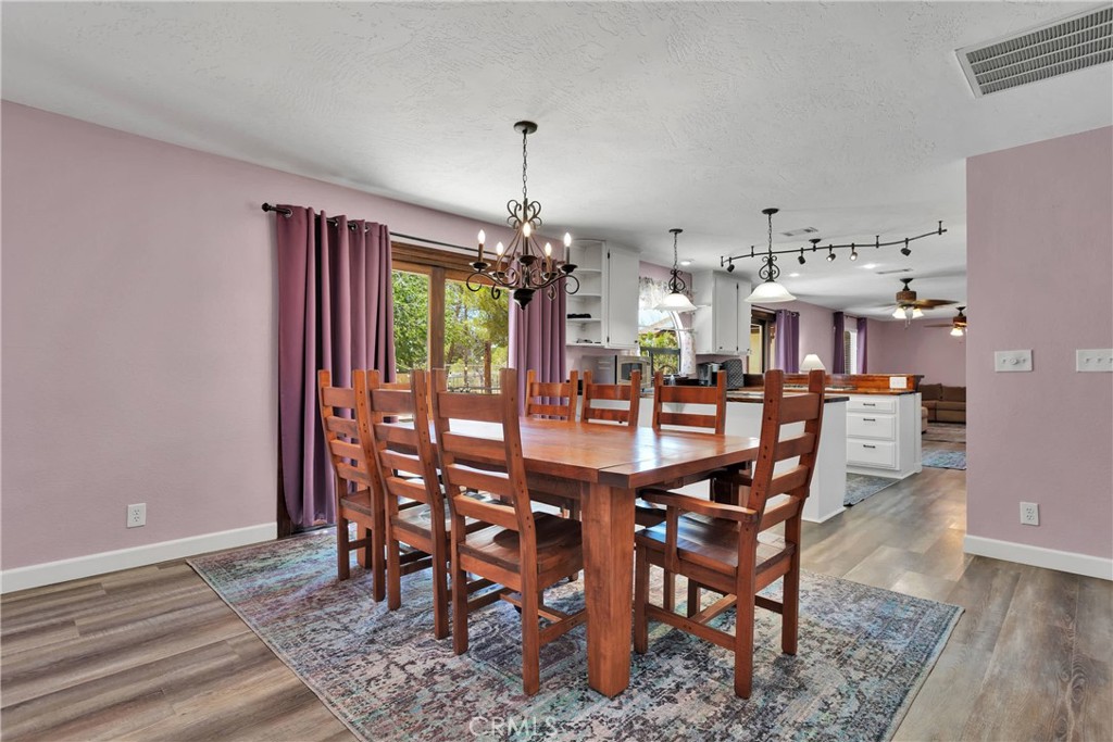 19095 Munsee Road Apple Valley, CA 92307 - Photo 6 of 58 a dining room with furniture window and wooden floor