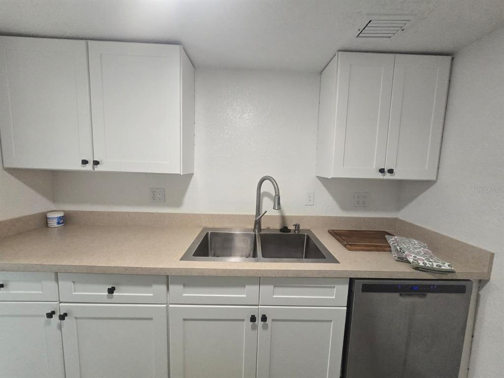 902 Lake Destiny Road, Unit C Altamonte Springs, FL 32714 - Photo 7 of 23 a kitchen with a sink and cabinets