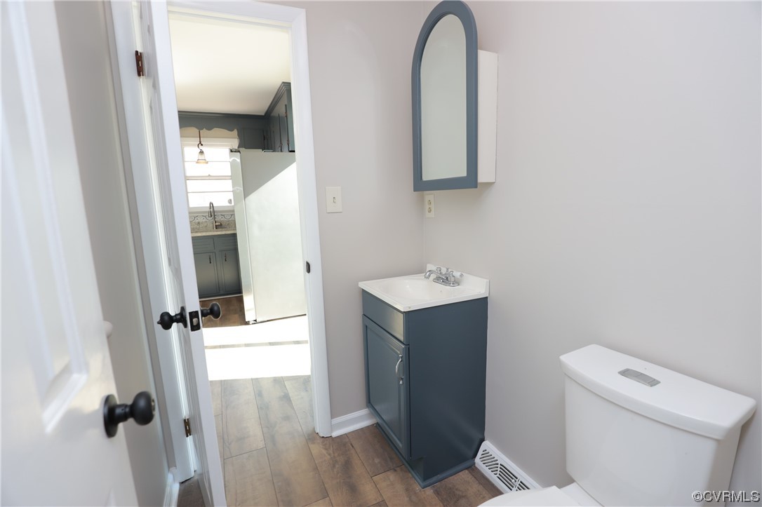 1355 Robindale Road Richmond, VA 23235 - Photo 15 of 35 a bathroom with a sink and mirror with toilet