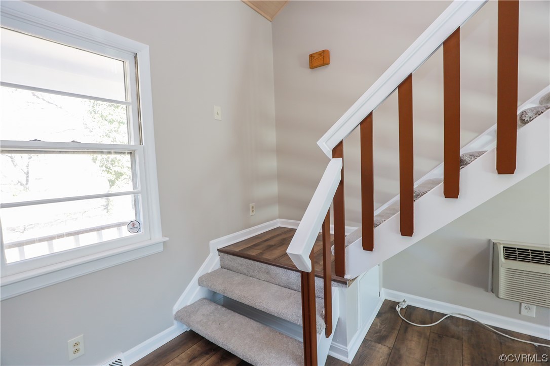 1355 Robindale Road Richmond, VA 23235 - Photo 17 of 35 a view of staircase with wooden floor and white walls