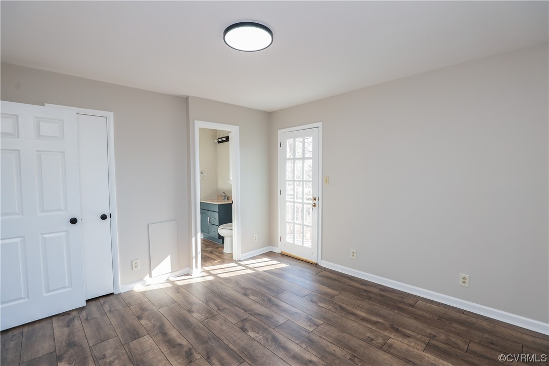 1355 Robindale Road Richmond, VA 23235 - Photo 21 of 35 an empty room with wooden floor and windows