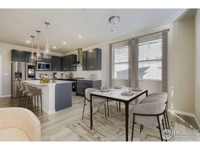 a kitchen with a table and chairs in it