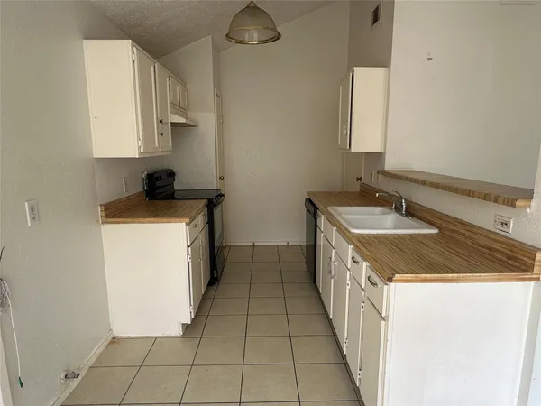 a utility room with a sink a washer and dryer