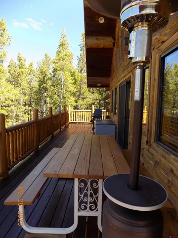 a view of balcony with wooden floor
