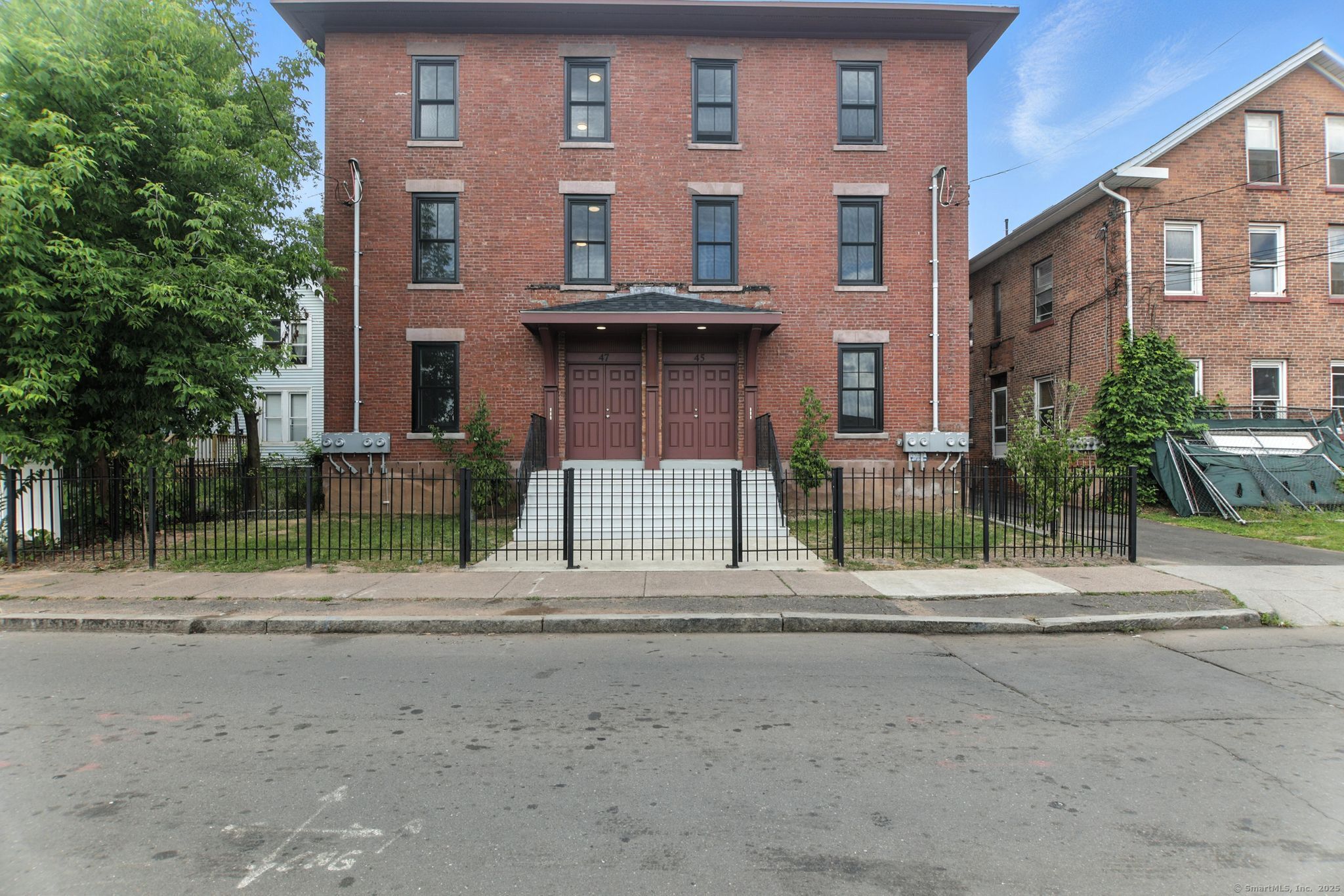 45 Squire Street Hartford, CT 06106 - Photo 1 of 1 a front view of a house with a yard