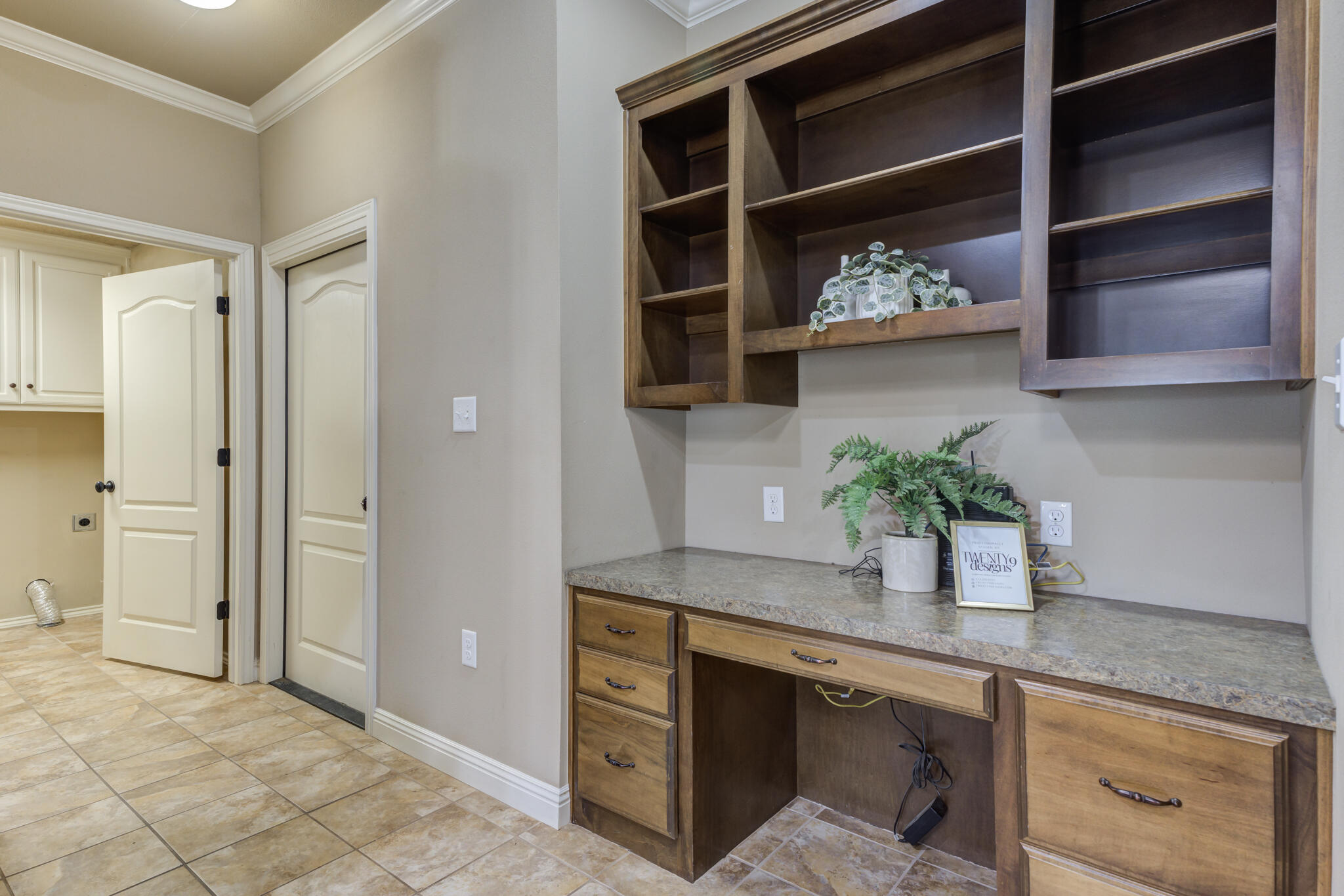 6512 71st Street Lubbock, TX 79424 - Photo 18 of 41 a kitchen with a sink and a potted plant