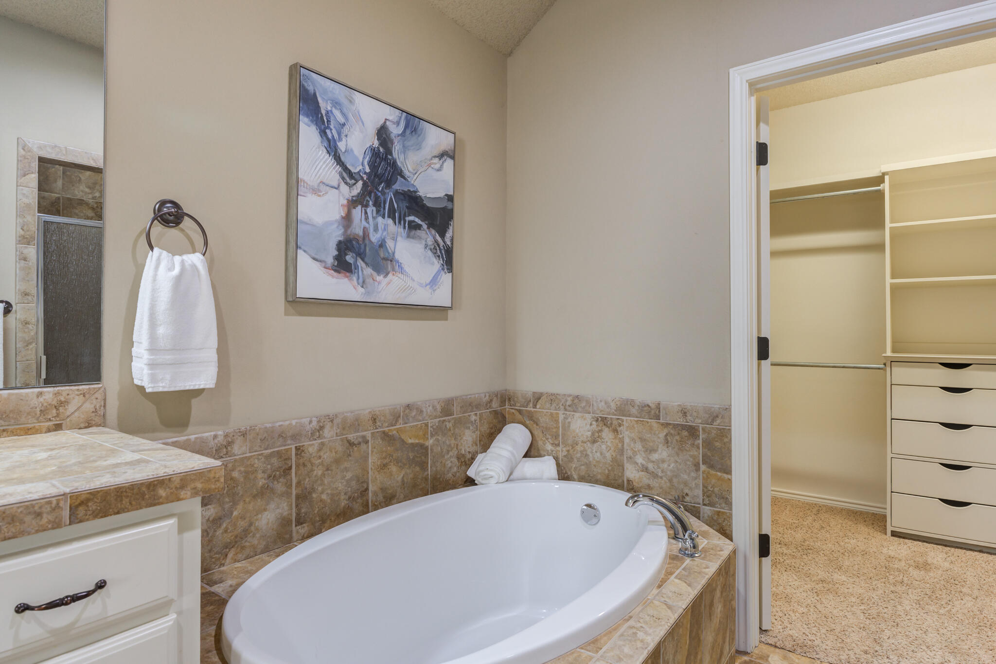 6512 71st Street Lubbock, TX 79424 - Photo 26 of 41 a bathroom with a tub and a shower