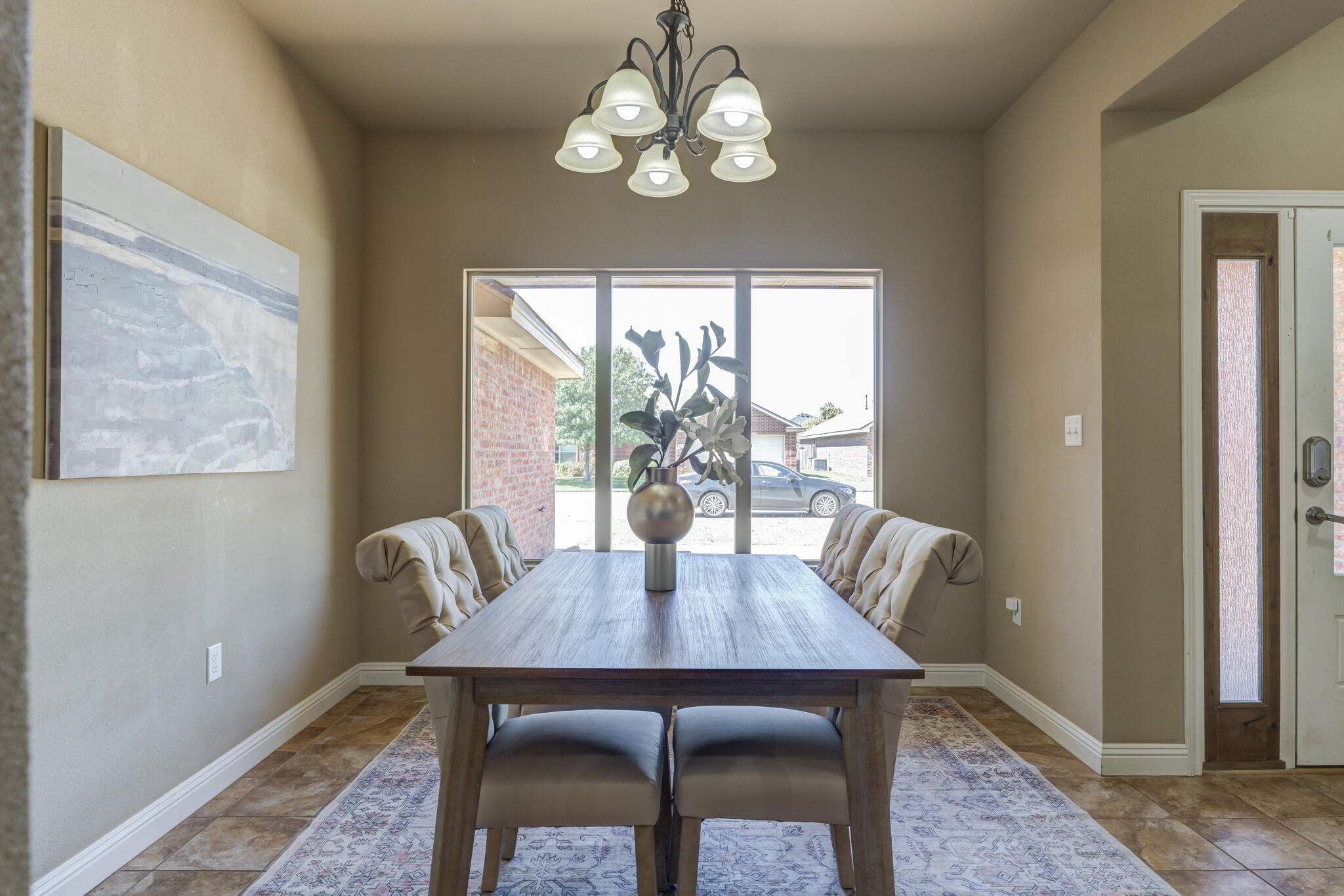 6512 71st Street Lubbock, TX 79424 - Photo 4 of 41 a view of a dining room with furniture window and wooden floor