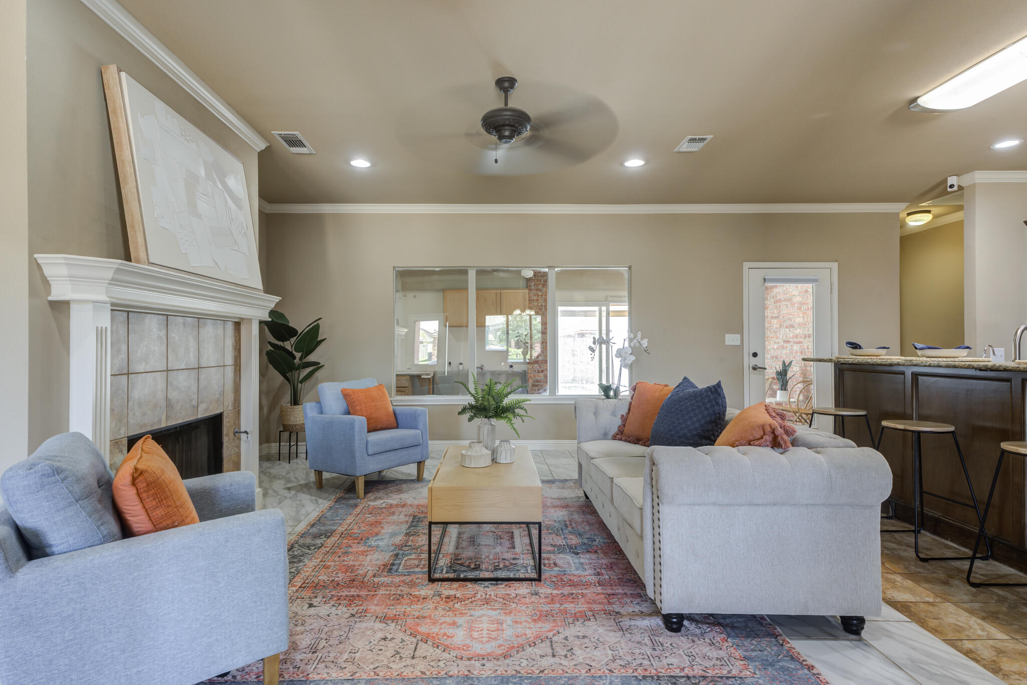 6512 71st Street Lubbock, TX 79424 - Photo 6 of 41 a living room with furniture and a fireplace