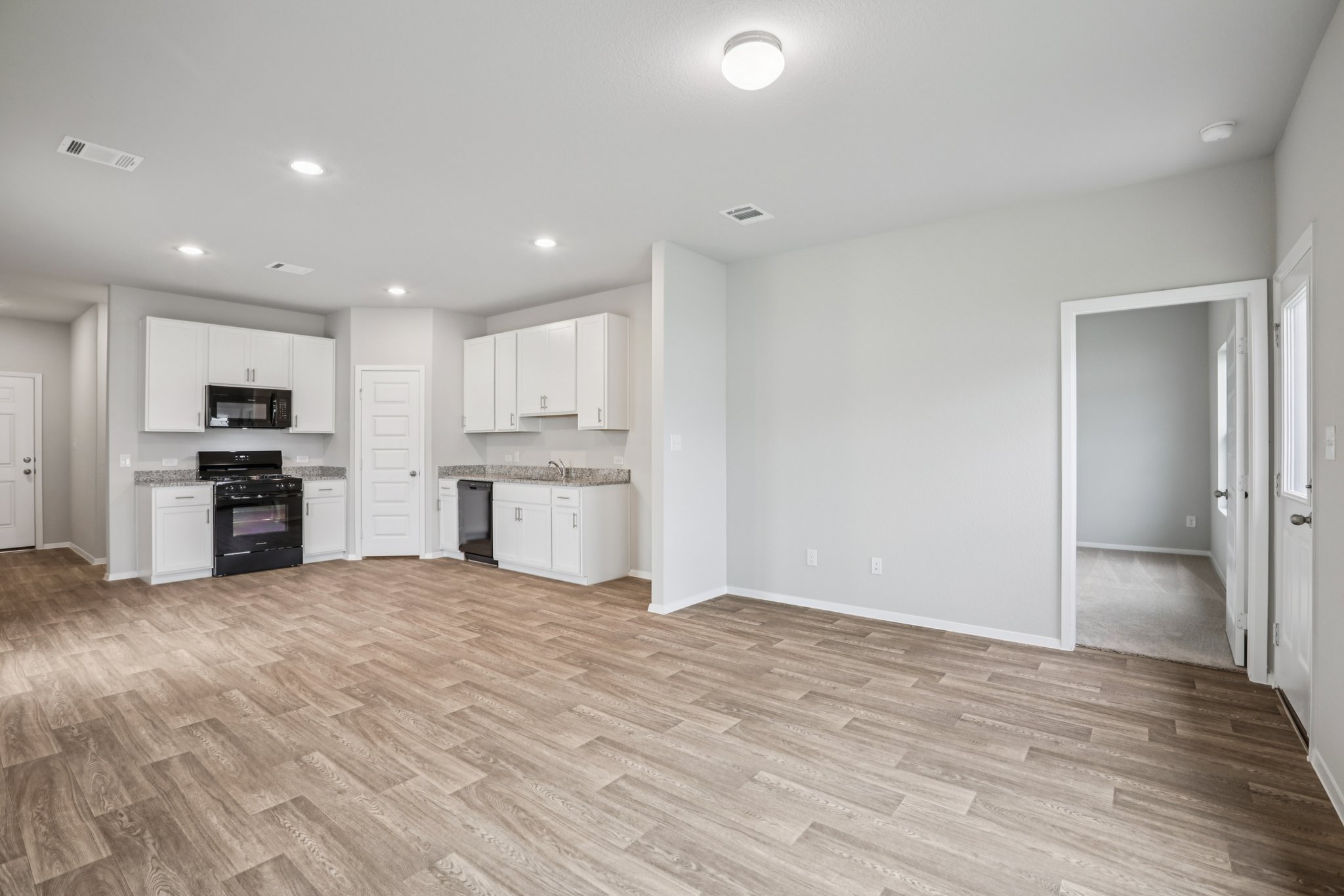104 Summer Drive Elgin, TX 78621 - Photo 11 of 40 a view of kitchen with wooden floor