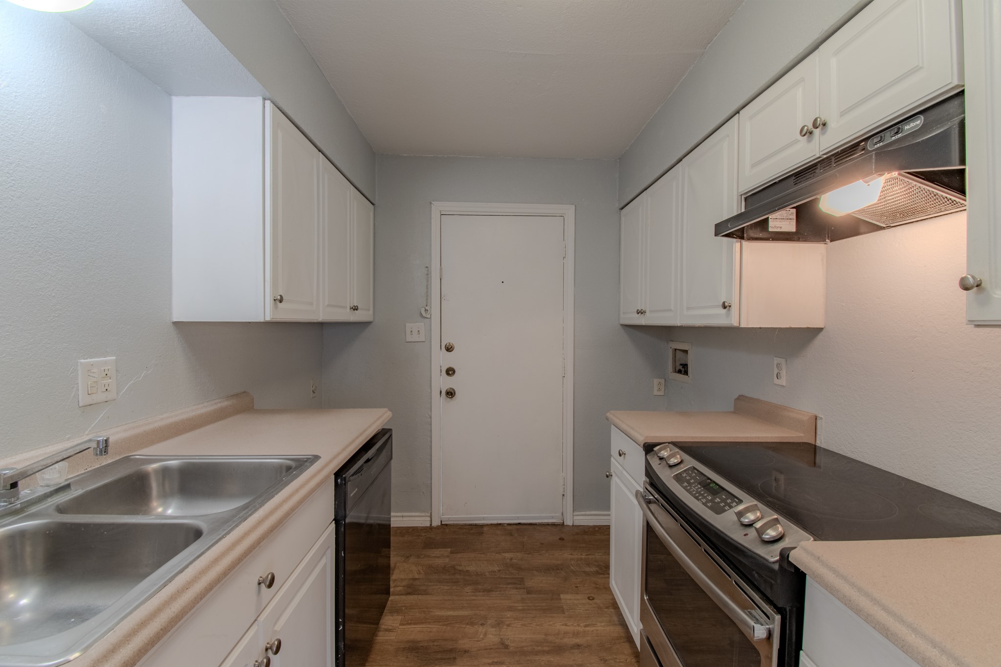 100 Uhland Road, Unit 3 San Marcos, TX 78666 - Photo 10 of 26 a kitchen that has a sink and a stove