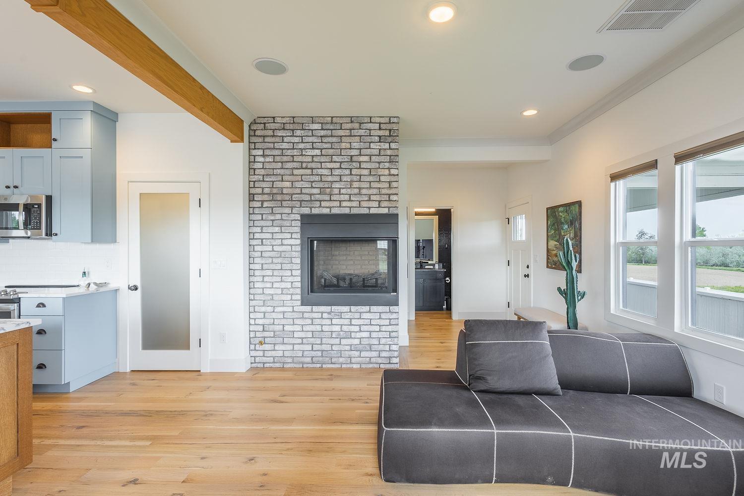 11171 Pump Road Nampa, ID 83686 - Photo 17 of 50 Light wood-finish flooring extending throughout the open concept space