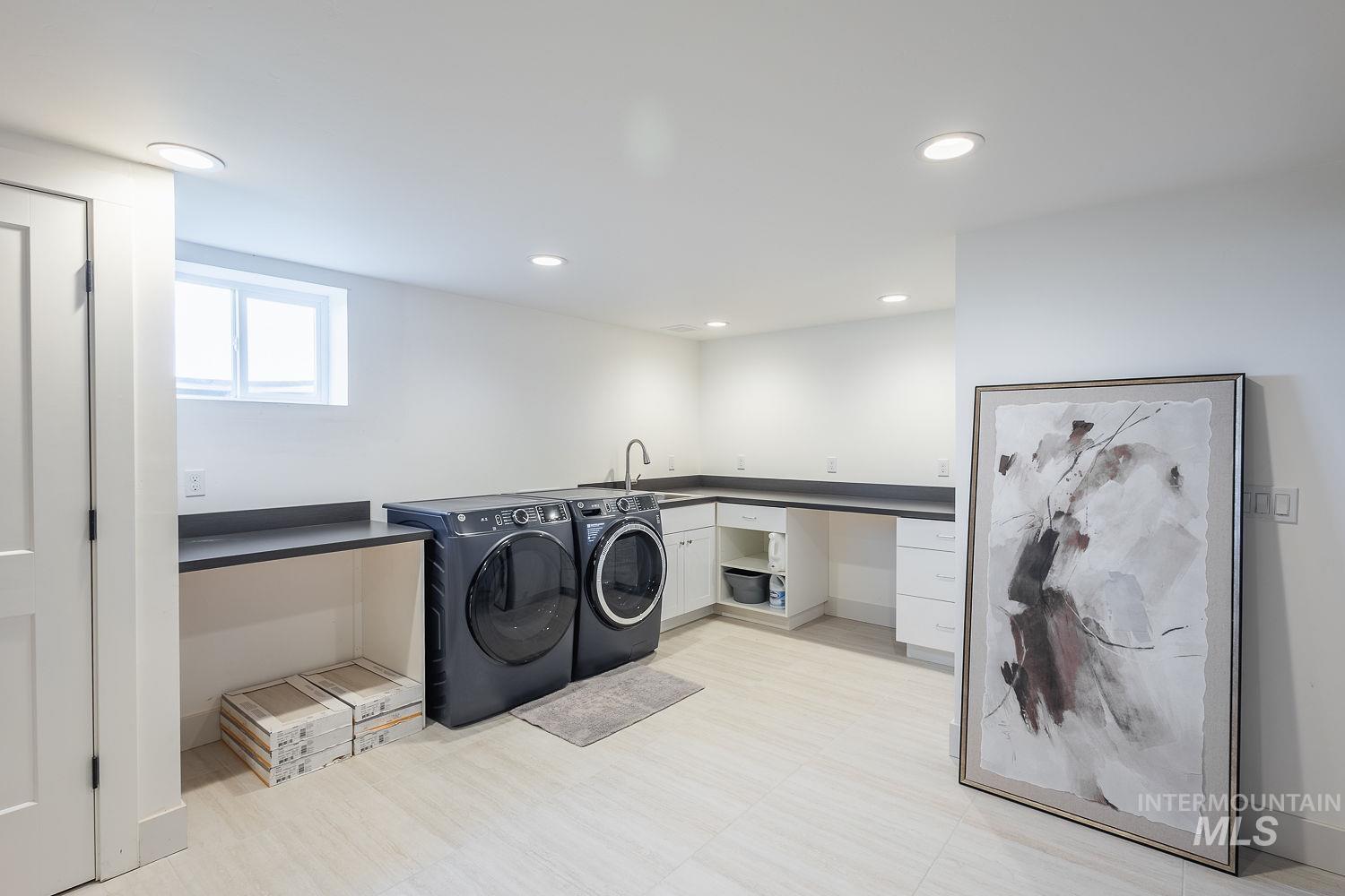 11171 Pump Road Nampa, ID 83686 - Photo 31 of 50 Dedicated laundry area featuring a utility sink, dark countertops, white cabinetry, and recessed lighting