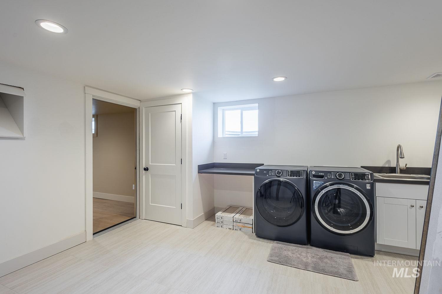 11171 Pump Road Nampa, ID 83686 - Photo 32 of 50 Dedicated laundry area featuring light wood-finish flooring, recessed lighting, and a utility sink with a pull-down faucet