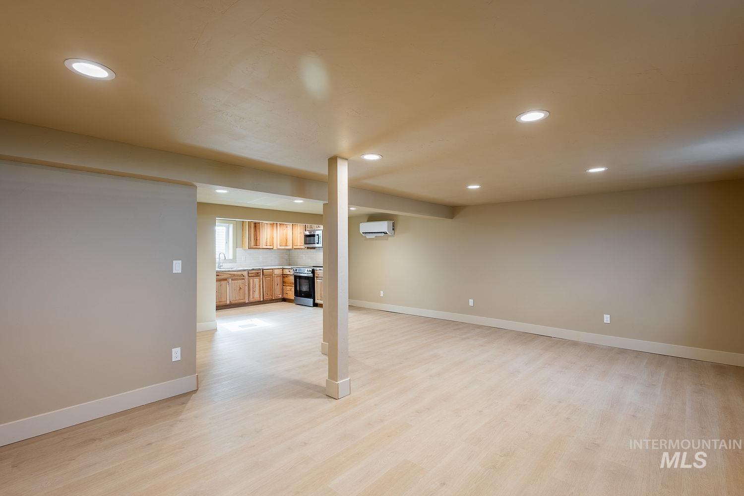 11171 Pump Road Nampa, ID 83686 - Photo 36 of 50 Open-concept living area featuring light wood-finish flooring, recessed lighting, and a neutral color palette