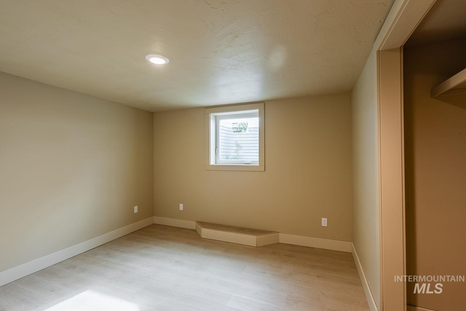 11171 Pump Road Nampa, ID 83686 - Photo 41 of 50 Spacious room with wood-finish flooring, recessed lighting, and a white-trimmed window