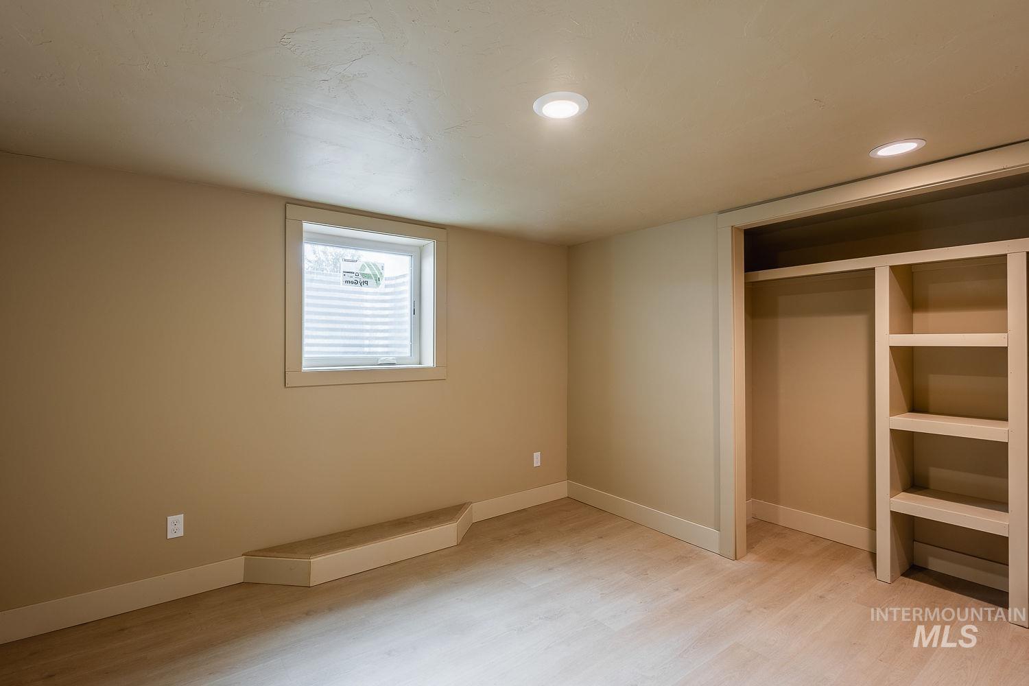 11171 Pump Road Nampa, ID 83686 - Photo 42 of 50 Room featuring light wood-finish flooring, recessed lighting, and a neutral wall color