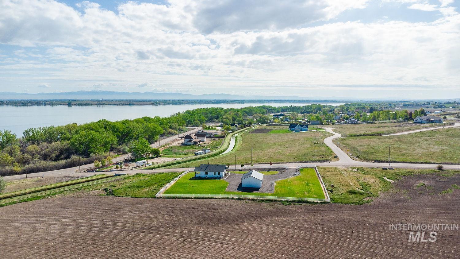 11171 Pump Road Nampa, ID 83686 - Photo 50 of 50 Aerial view showcasing a residential property with a single-story home and detached garage, surrounded by open land