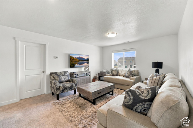 7939 Seattle Slew Road Eagle Mountain, UT 84005 - Photo 29 of 52 Neutral wall color, carpeted flooring, recessed lighting, white trim, and a window with a neighborhood backdrop