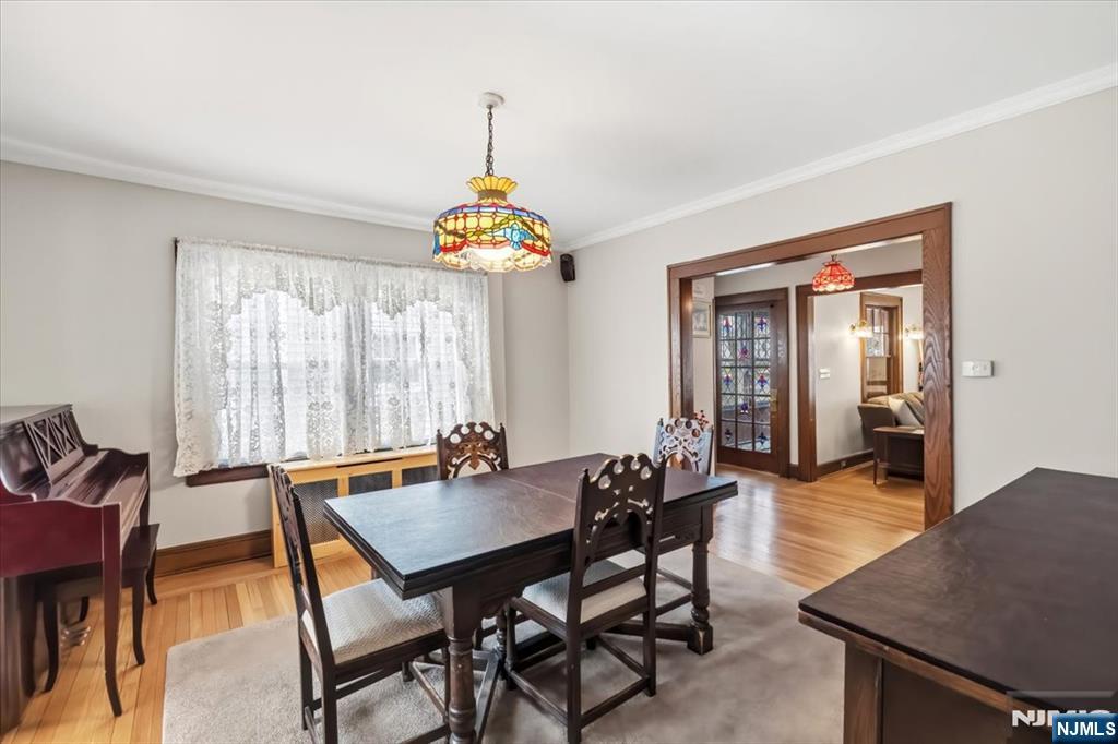 119 Overpeck Avenue Ridgefield Park, NJ 07660 - Photo 7 of 44 a view of a dining room with furniture window and wooden floor