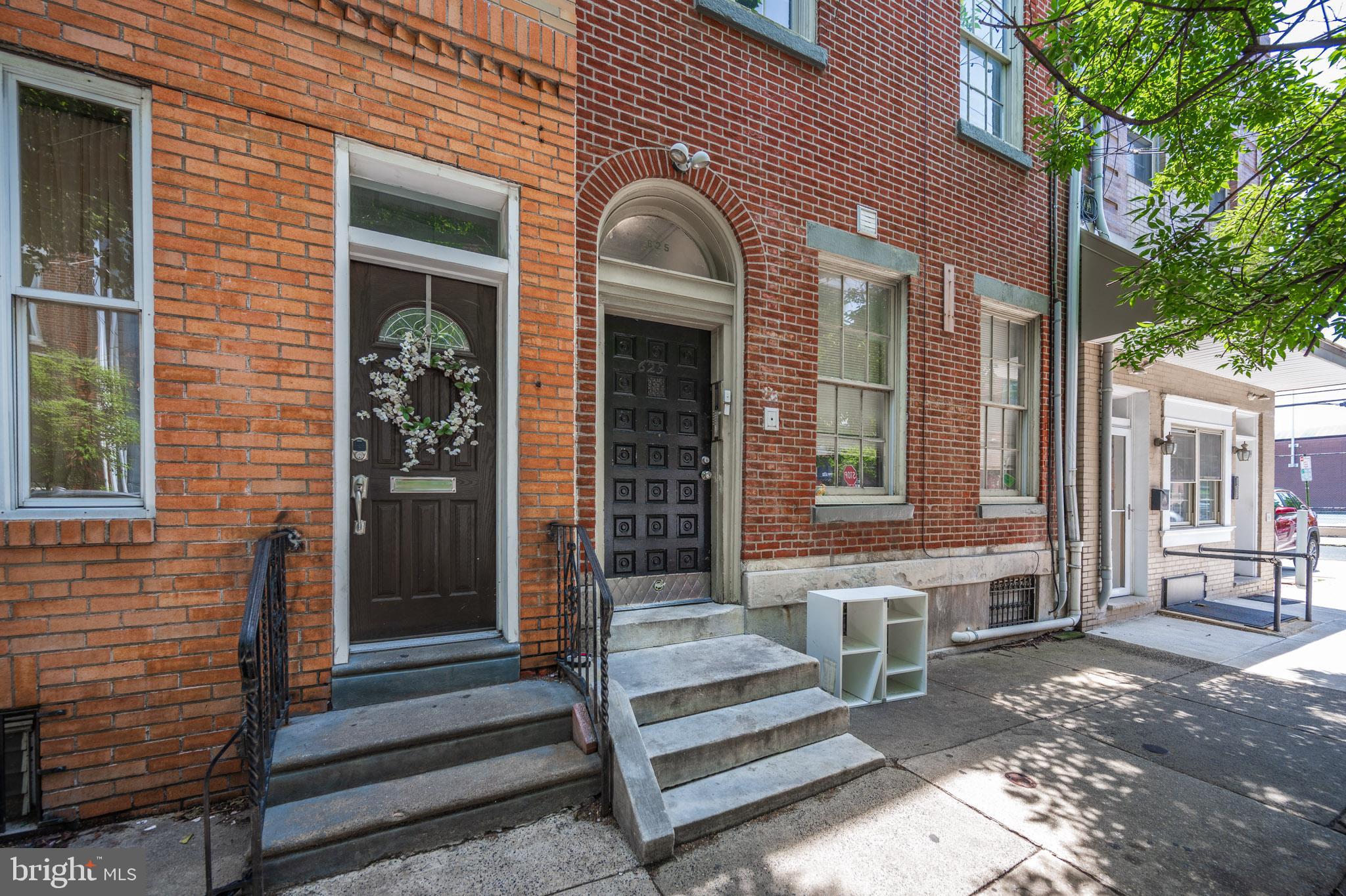 625 South 10th Street, Unit 2F Philadelphia, PA 19147 - Photo 12 of 13 a front view of a house with a garden