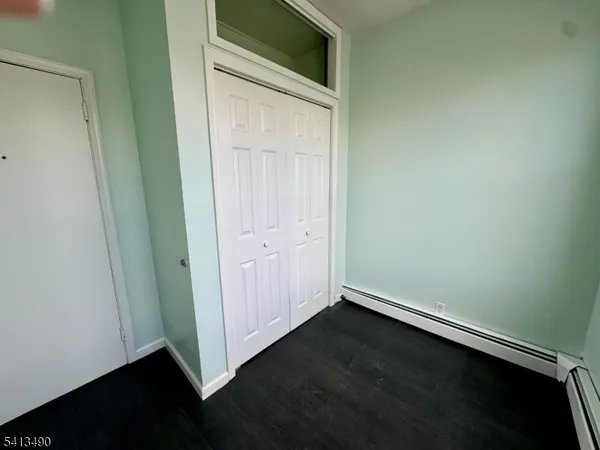 an empty room with wooden floor