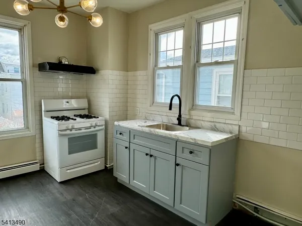a kitchen with a stove and a sink