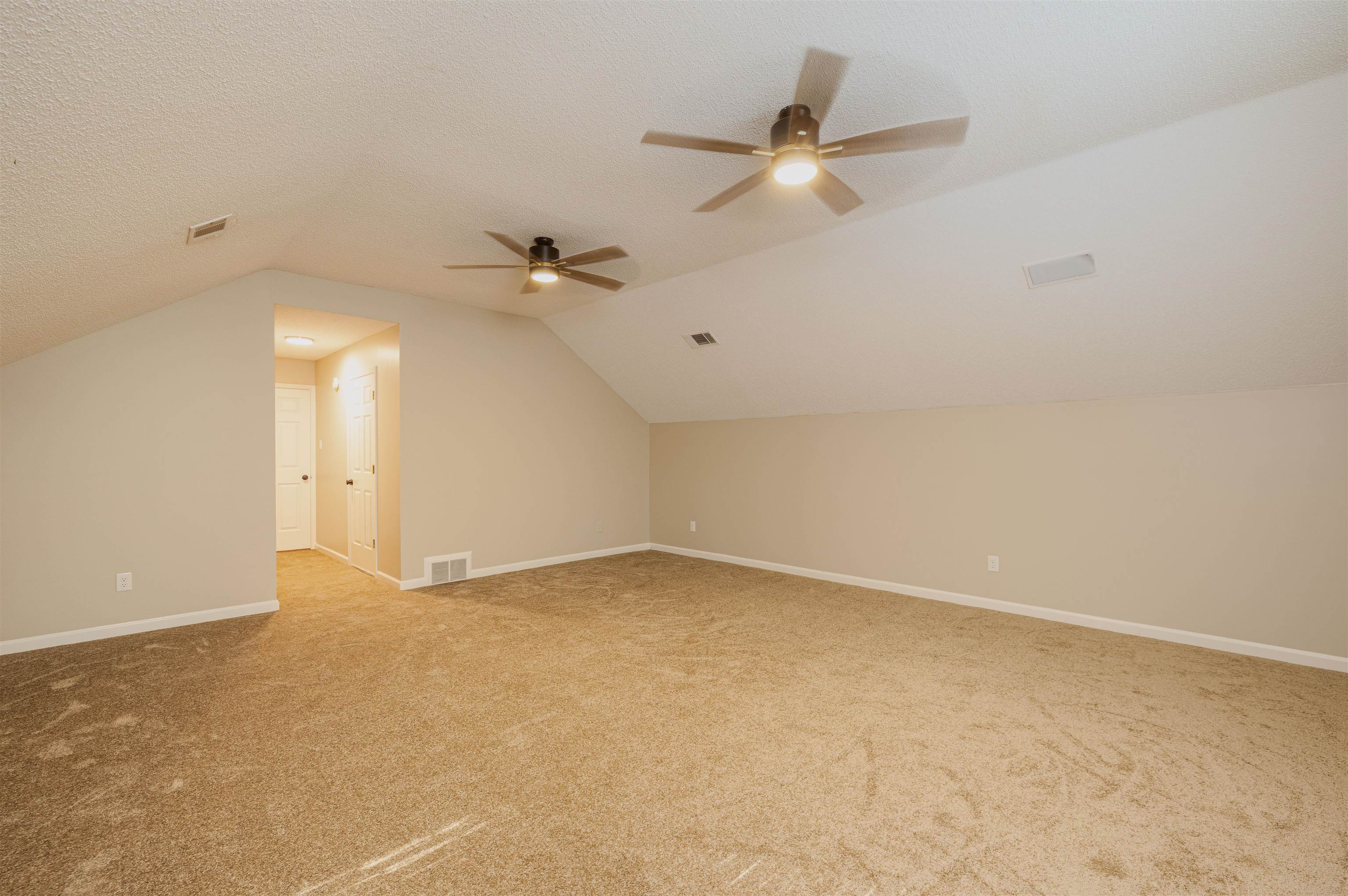 4808 Oak Road Bartlett, TN 38002 - Photo 18 of 35 Bedroom 4 /Bonus room featuring vaulted ceiling, a textured ceiling, light colored carpet, and ceiling fan