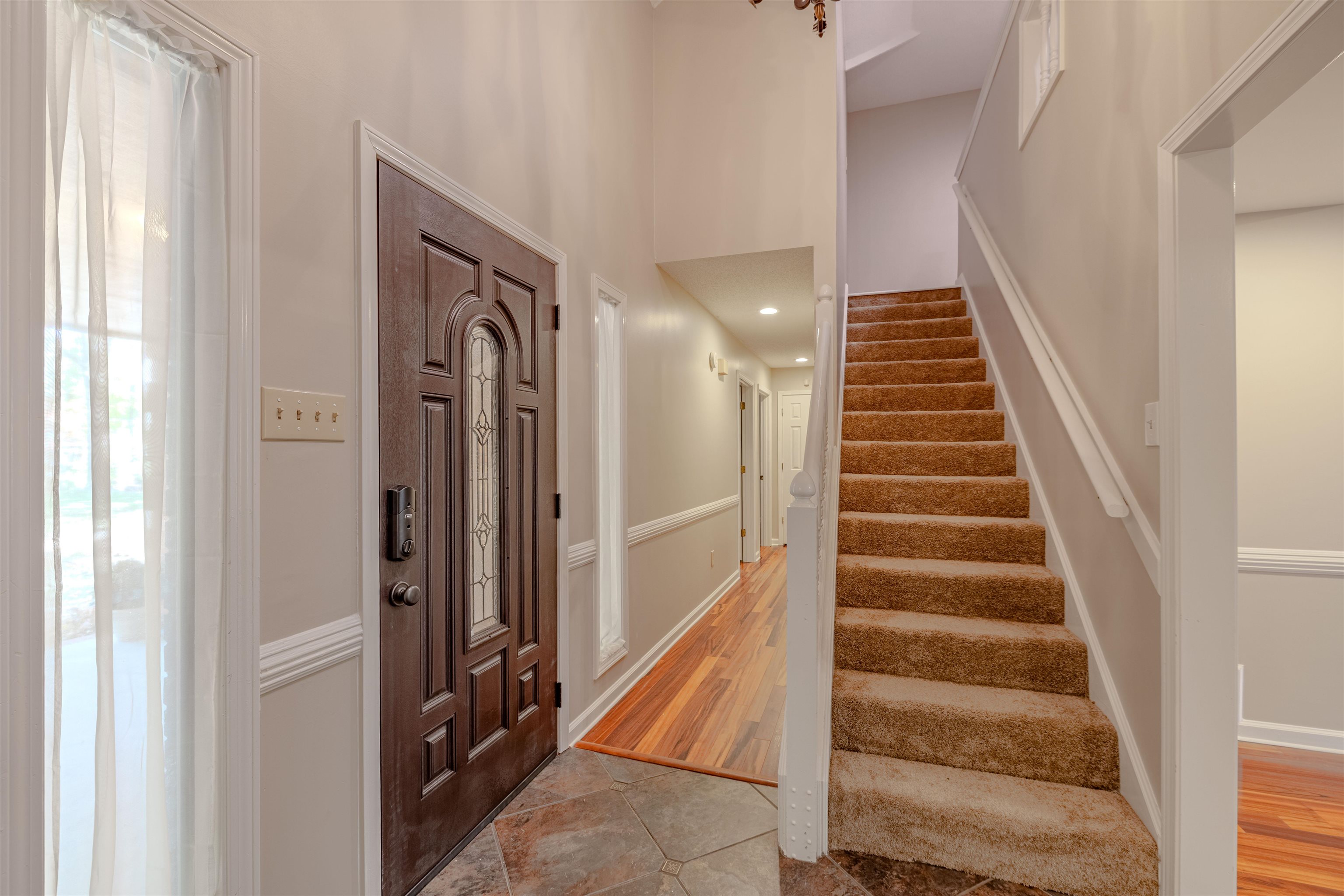 4808 Oak Road Bartlett, TN 38002 - Photo 7 of 35 Entrance foyer featuring stairway, light wood finished floors, and a towering ceiling