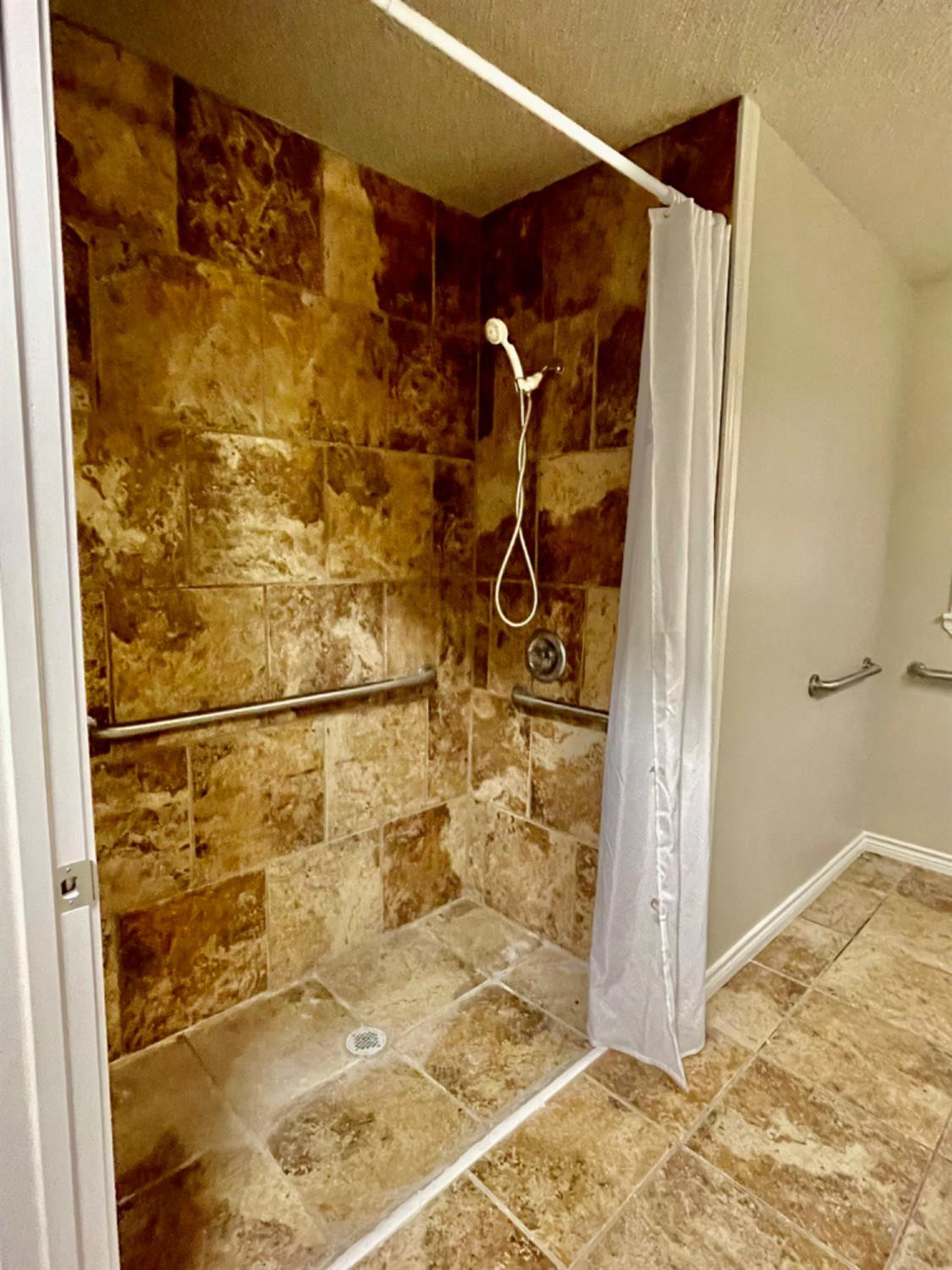 1201 Adrian Street Lubbock, TX 79403 - Photo 13 of 19 a bathroom with a shower