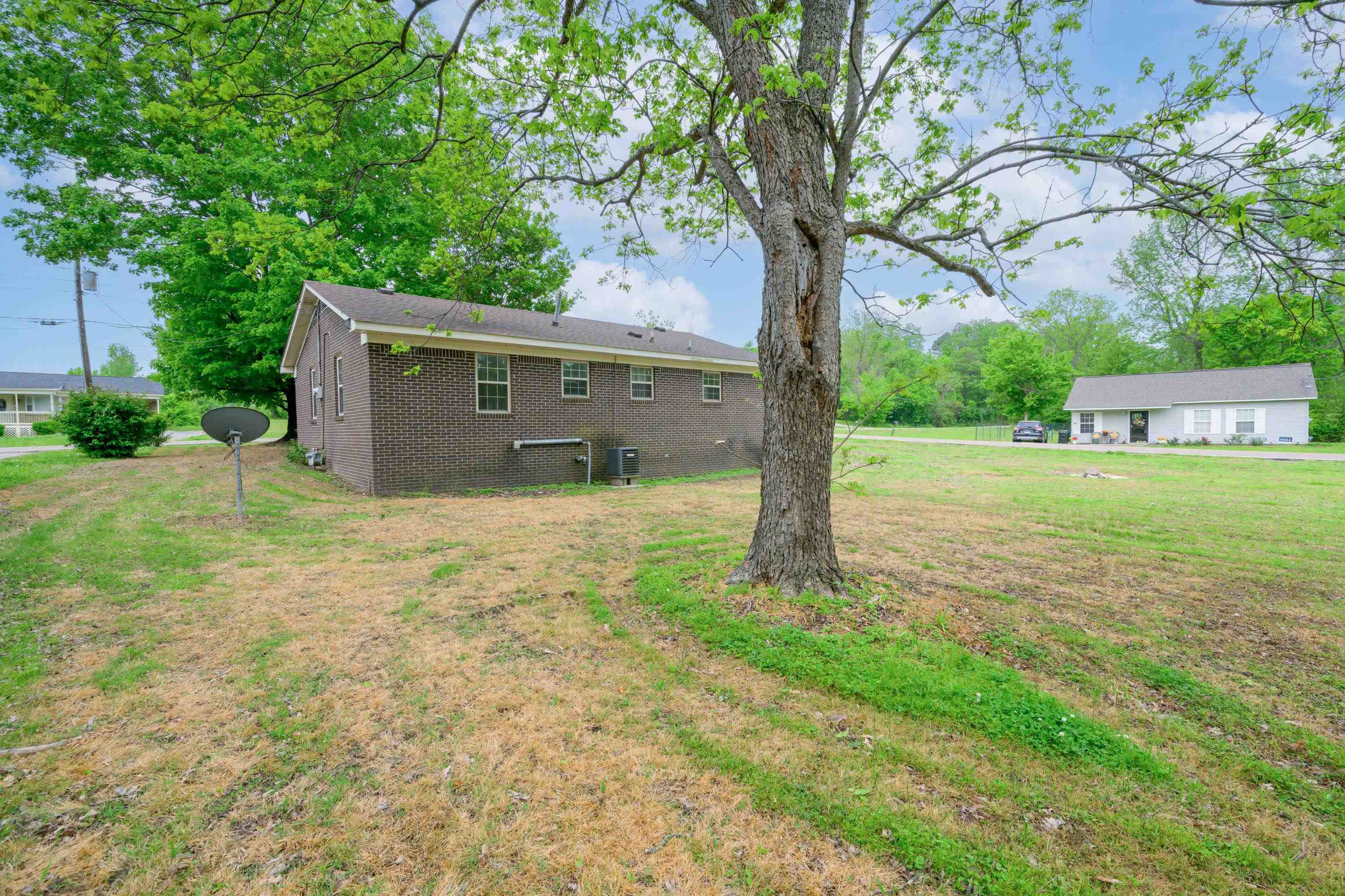 400 Coffee Shop Road Ripley, TN 38063 - Photo 17 of 23 a view of a house with backyard and a tree