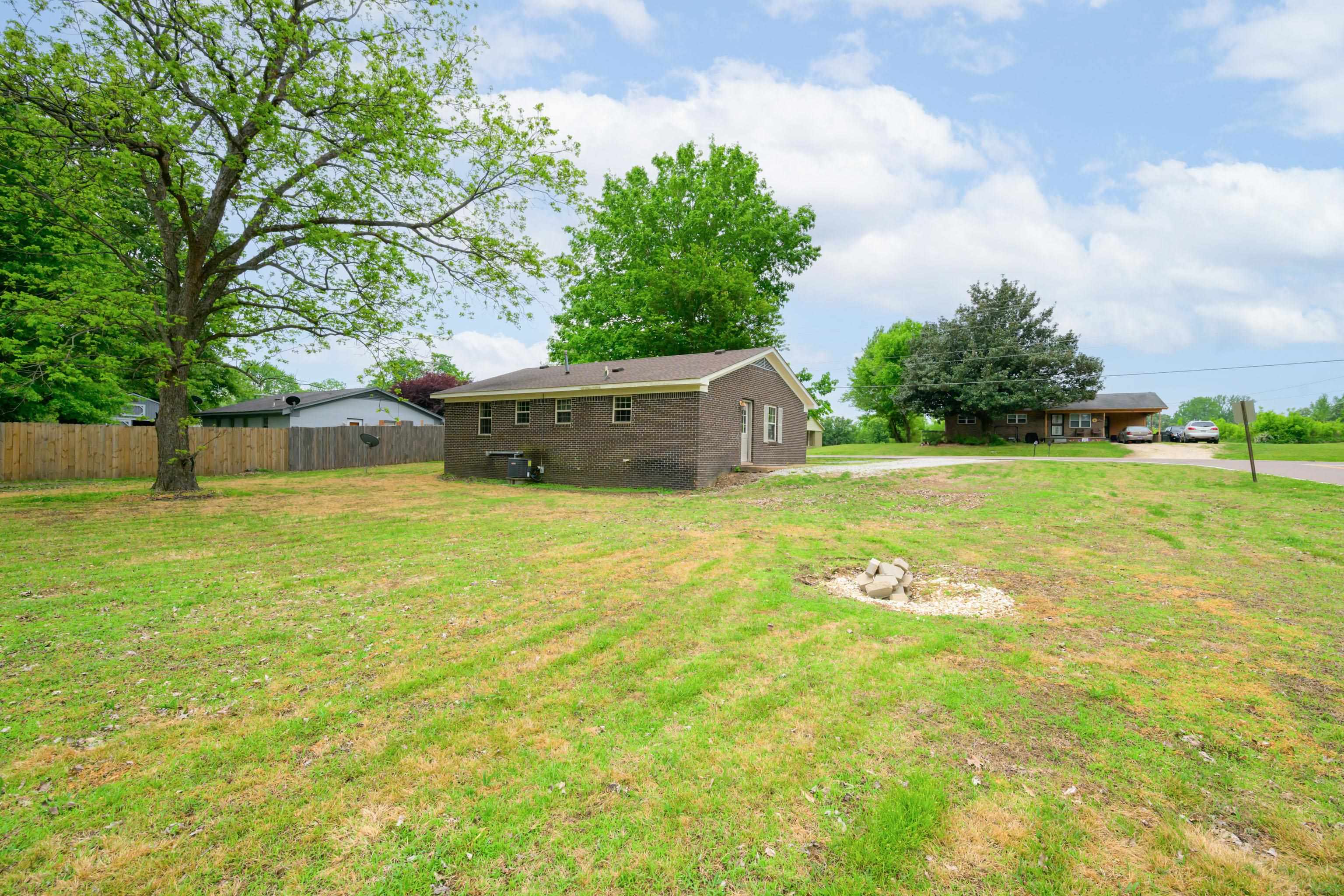 400 Coffee Shop Road Ripley, TN 38063 - Photo 20 of 23 a swimming pool with trees in the background