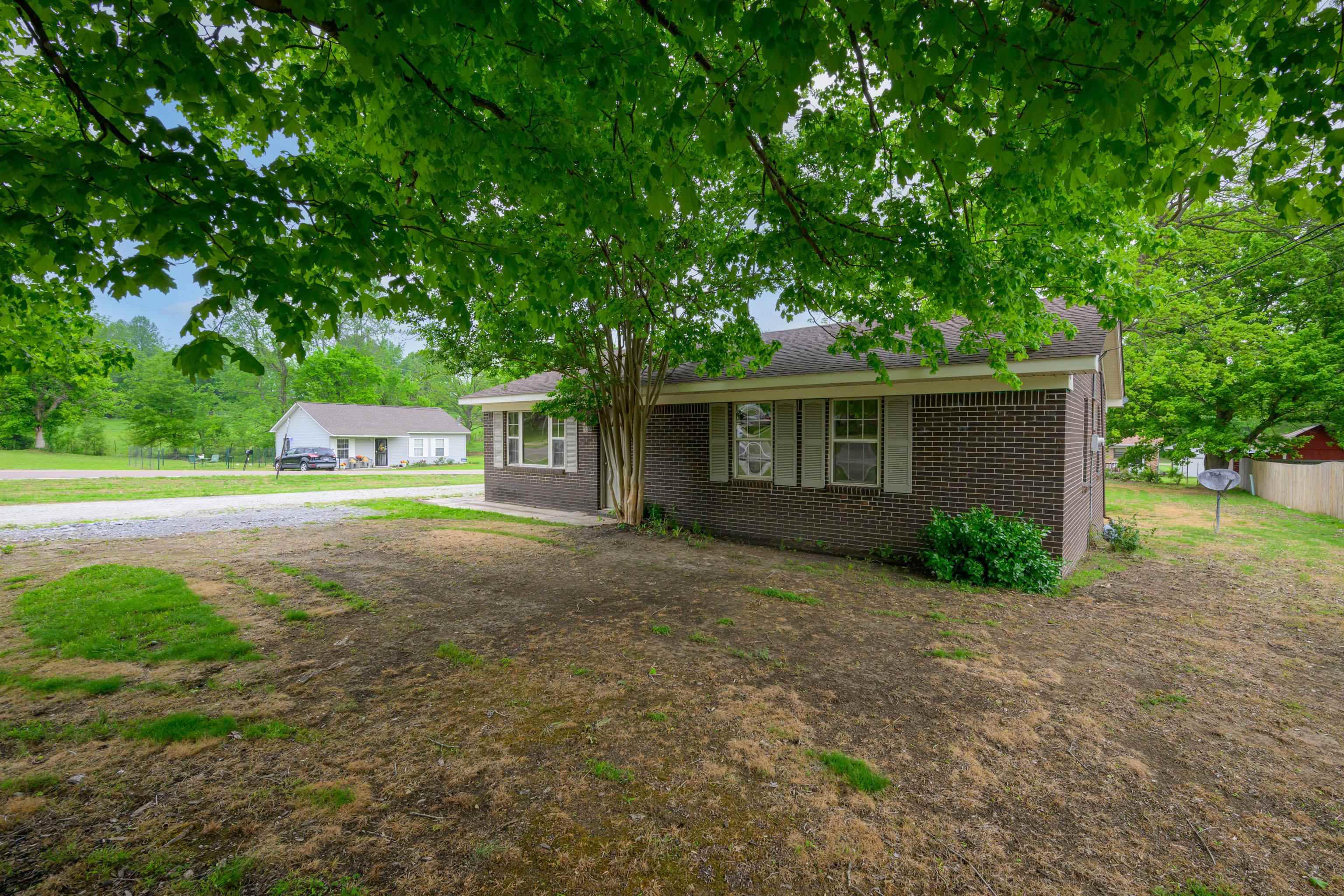 400 Coffee Shop Road Ripley, TN 38063 - Photo 21 of 23 a view of a house with a yard and garage