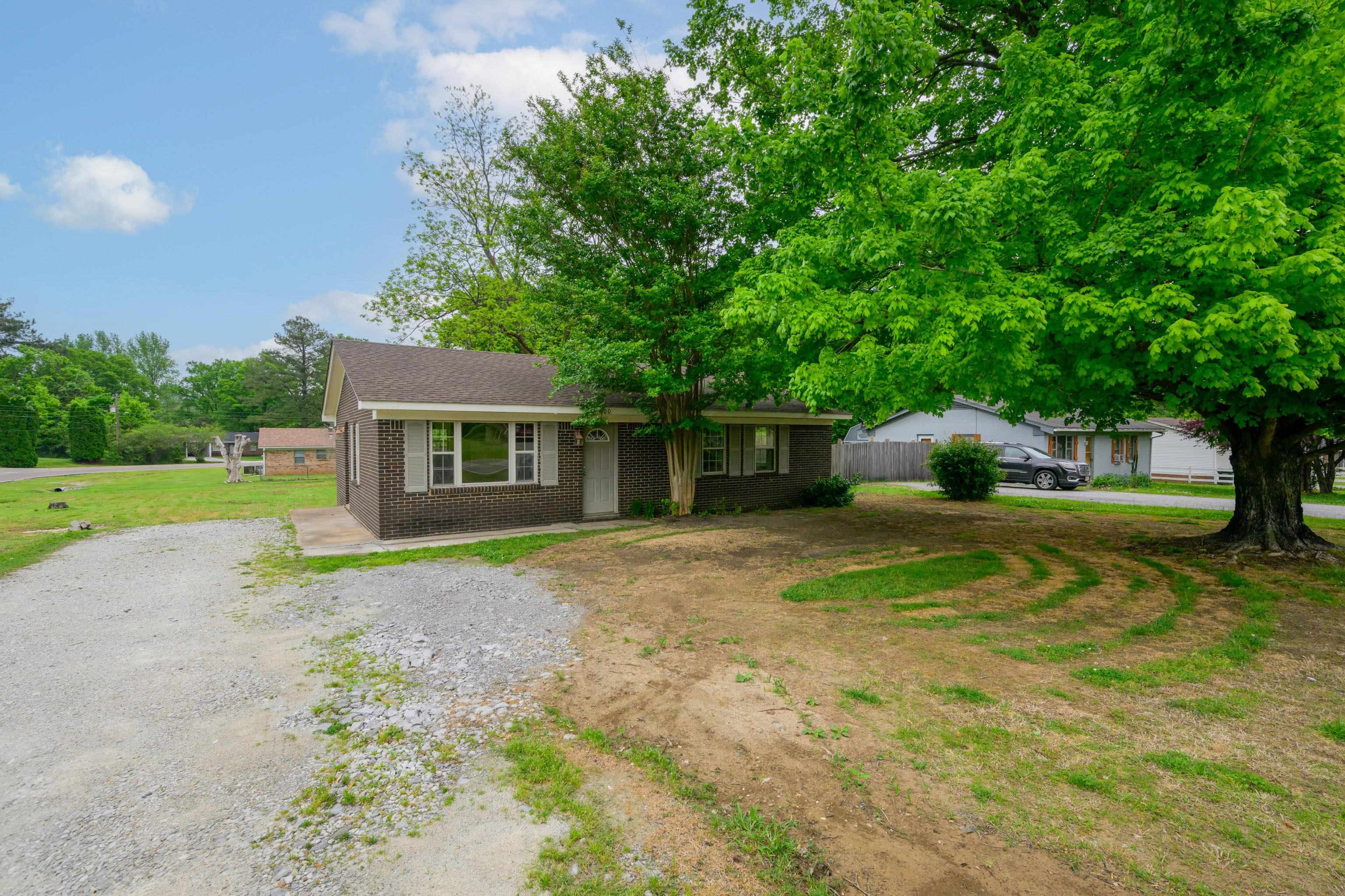 400 Coffee Shop Road Ripley, TN 38063 - Photo 23 of 23 a view of a house with backyard and a tree