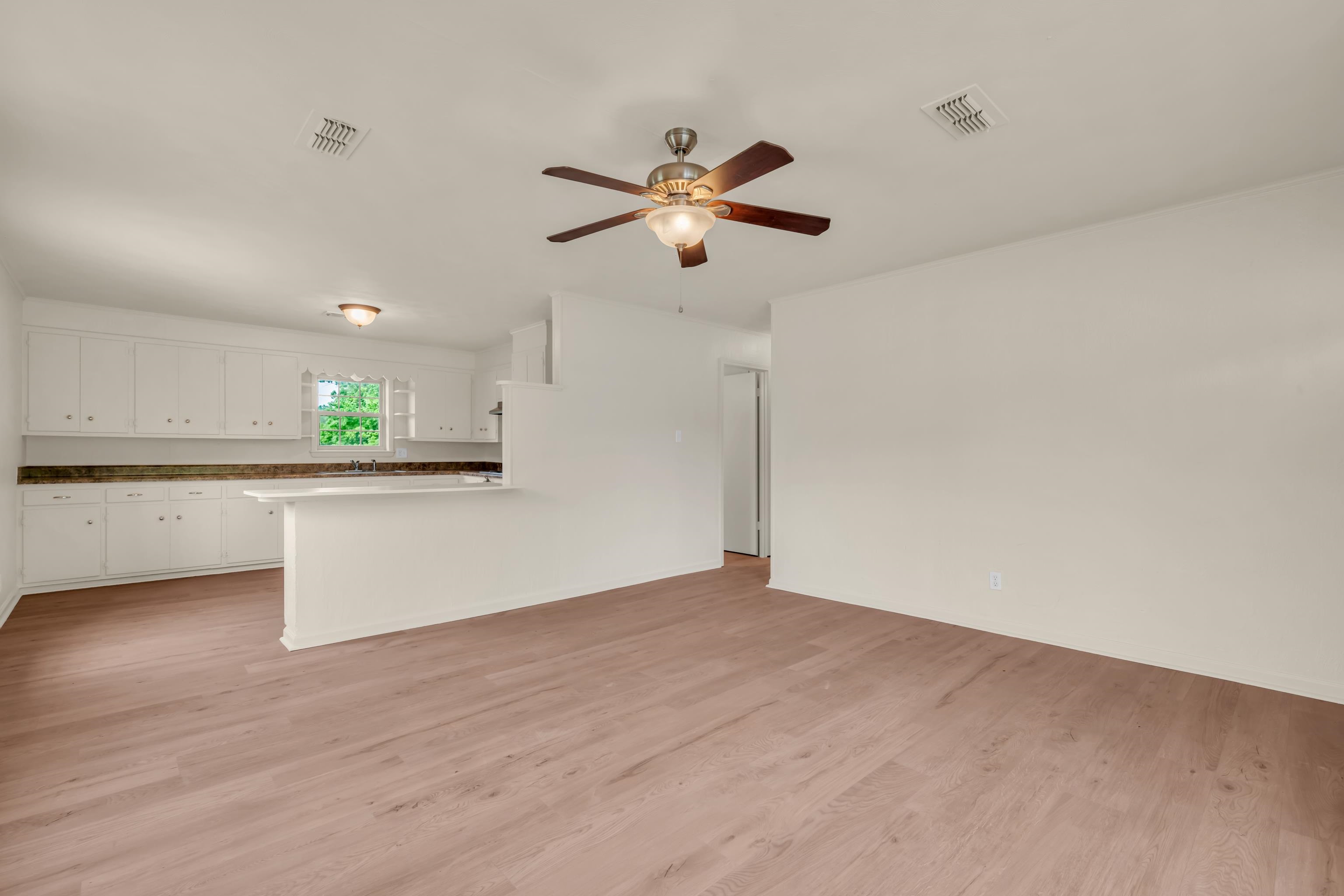 400 Coffee Shop Road Ripley, TN 38063 - Photo 4 of 23 a view of a kitchen with a dishwasher cabinets and wooden floor