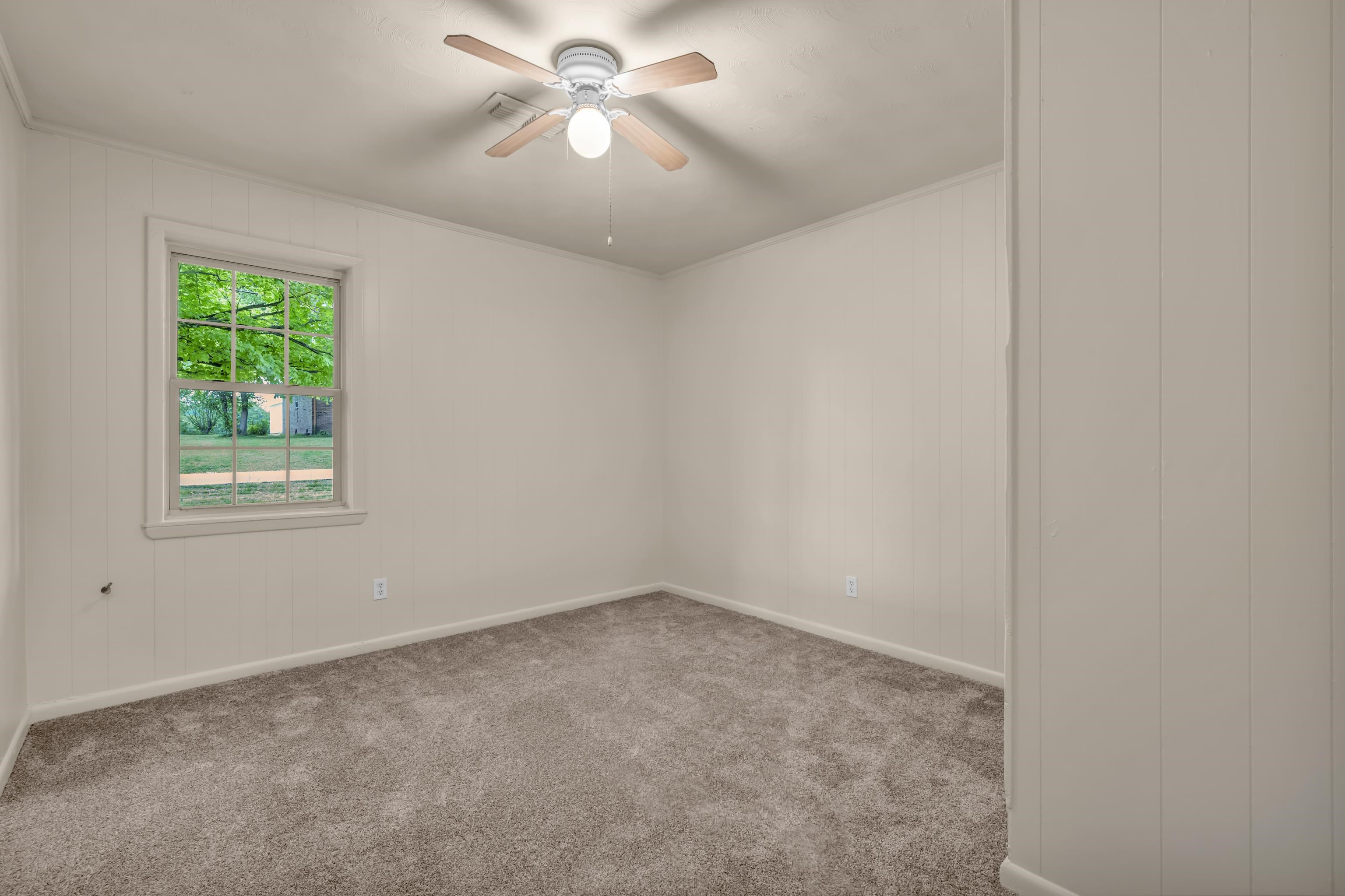 400 Coffee Shop Road Ripley, TN 38063 - Photo 10 of 23 an empty room with a window and a fan