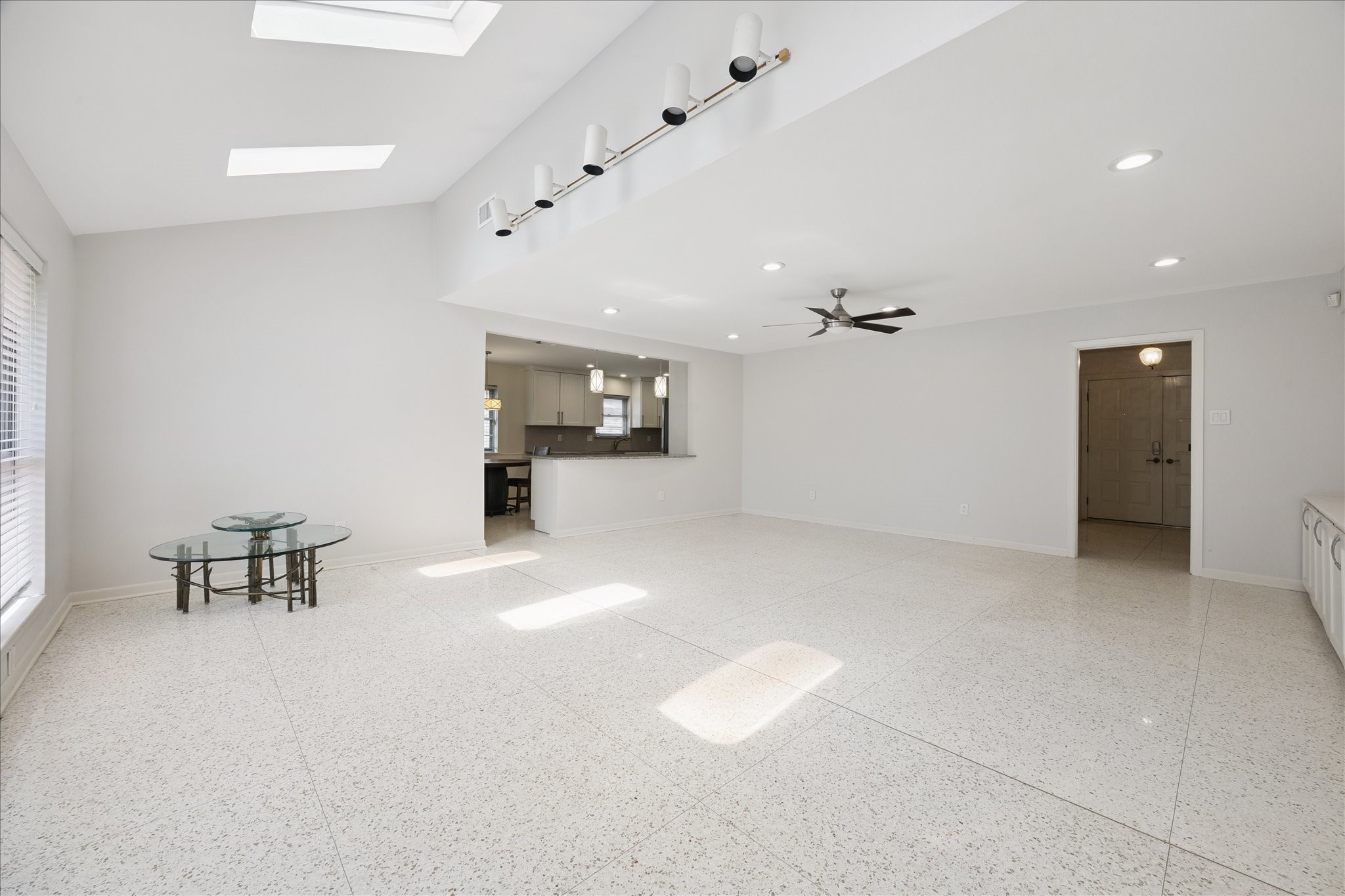 6115 Paisley Street Houston, TX 77096 - Photo 4 of 22 Another view of the living room that is open to the kitchen. Breakfast bar seats 3 comfortably.