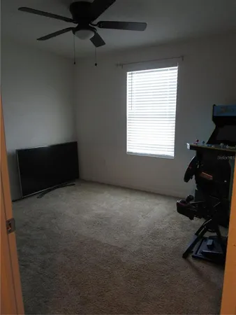 a room with gym equipment and a window